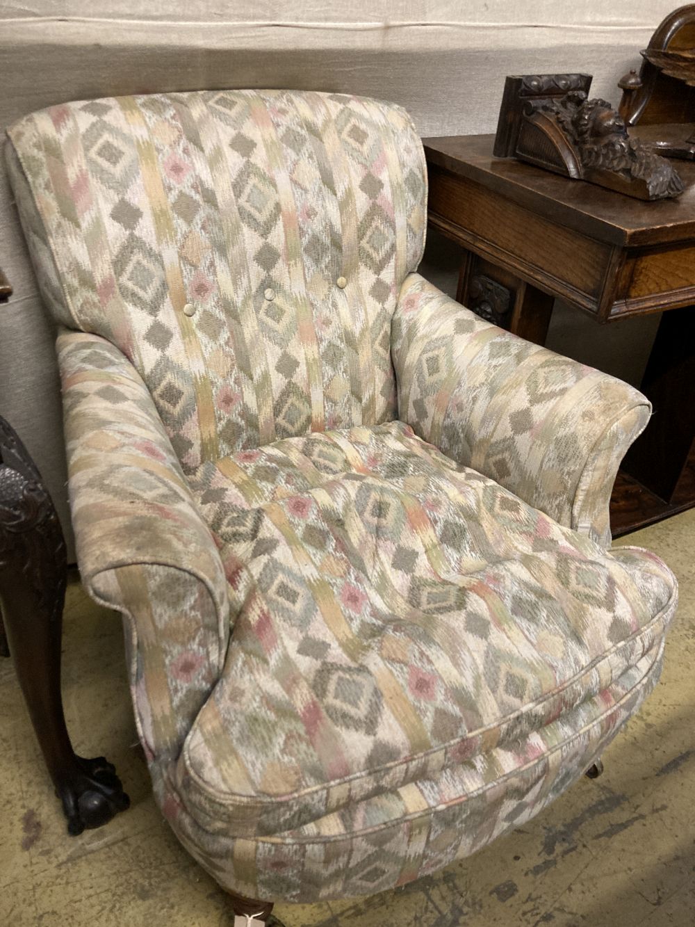 A late Victorian upholstered armchair